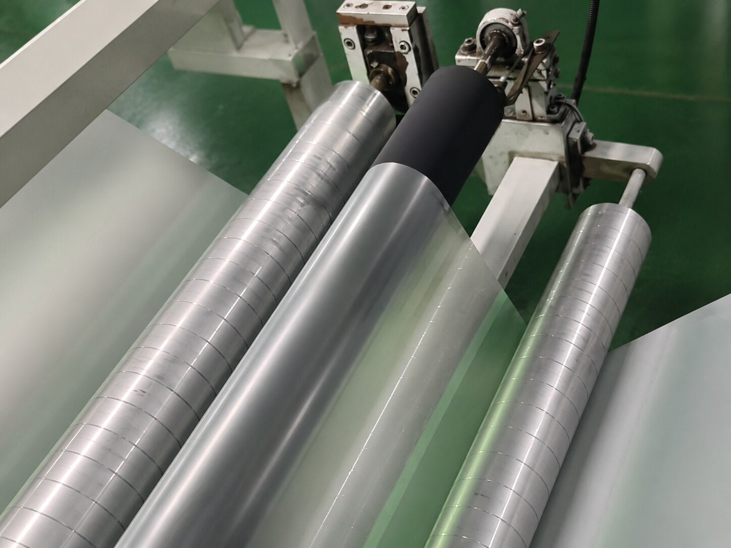 PET film passing through precision coating and leveling rollers